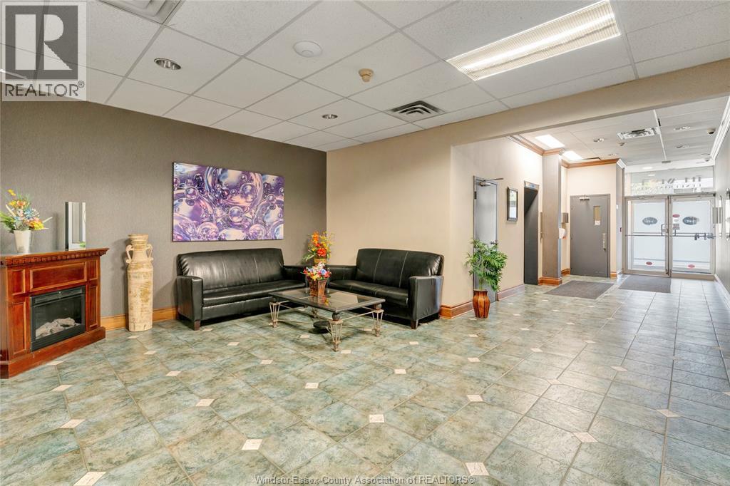 540 Ouellette Unit# 7B, Windsor, ON - Indoor With Fireplace
