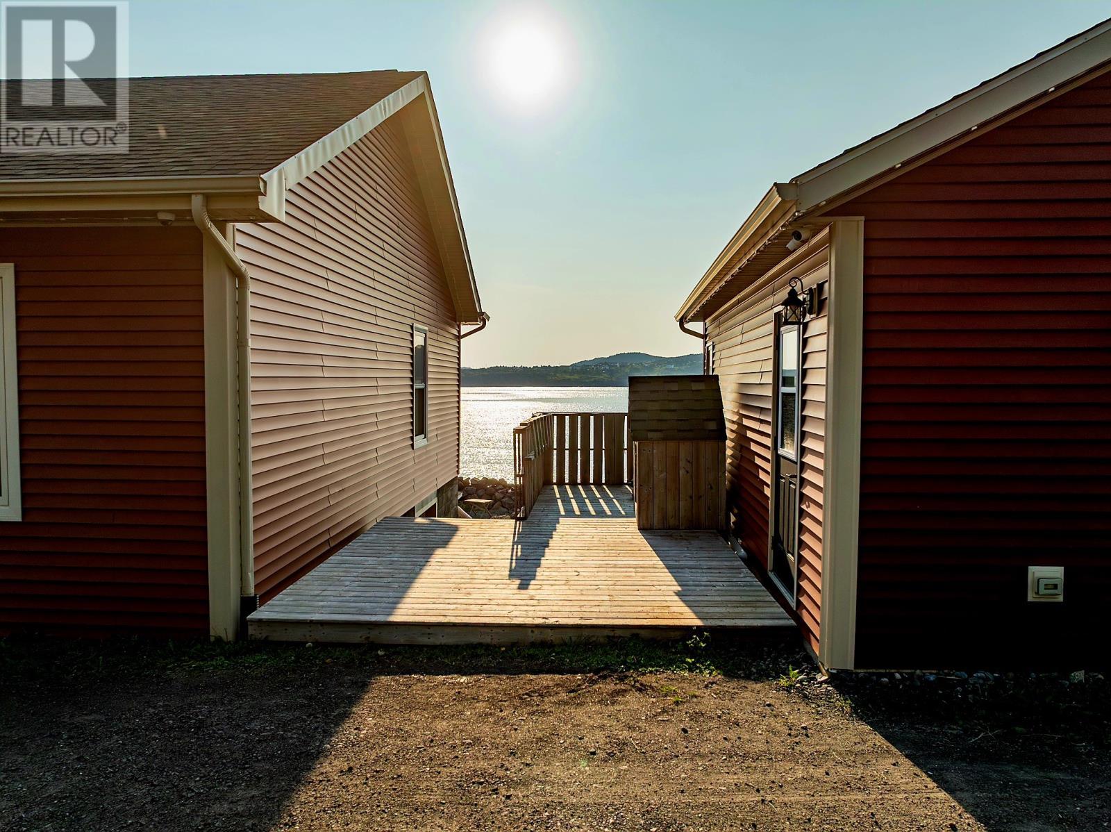 deck between house and garage - 8, 8A, 10 Main Street, Twillingate, NL