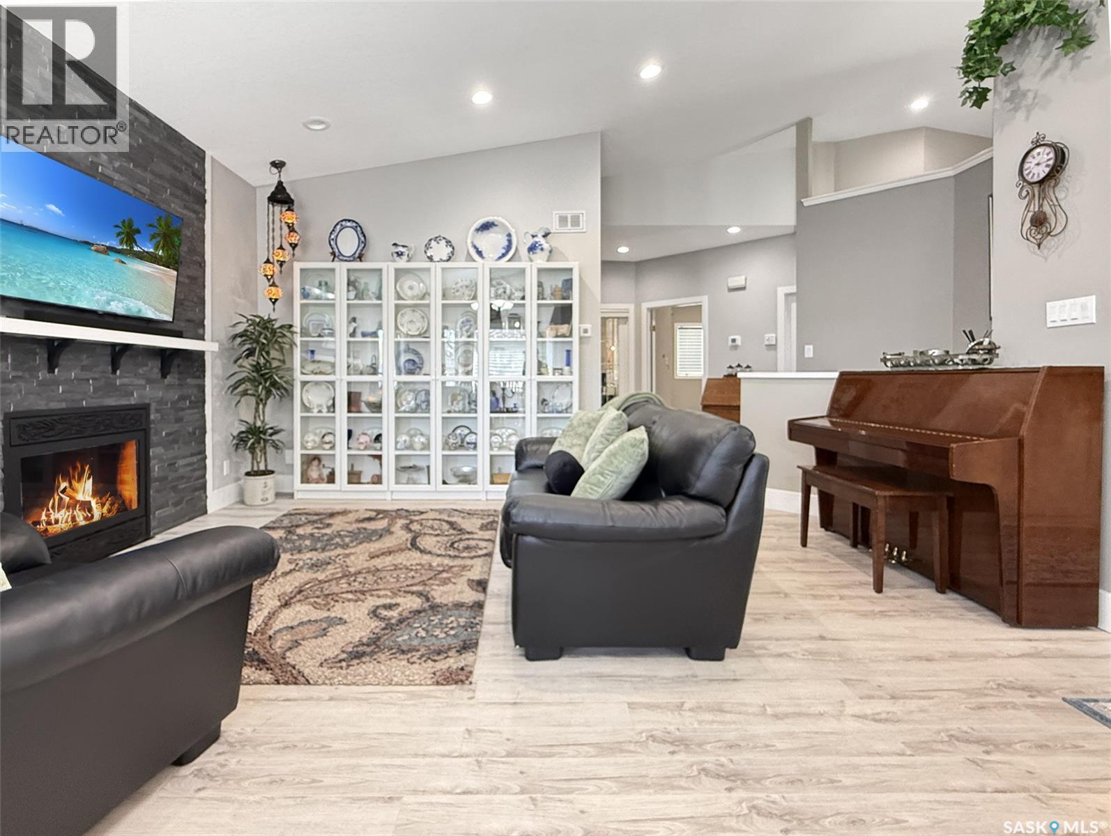 623 Highland Drive, Swift Current, SK - Indoor Photo Showing Living Room With Fireplace