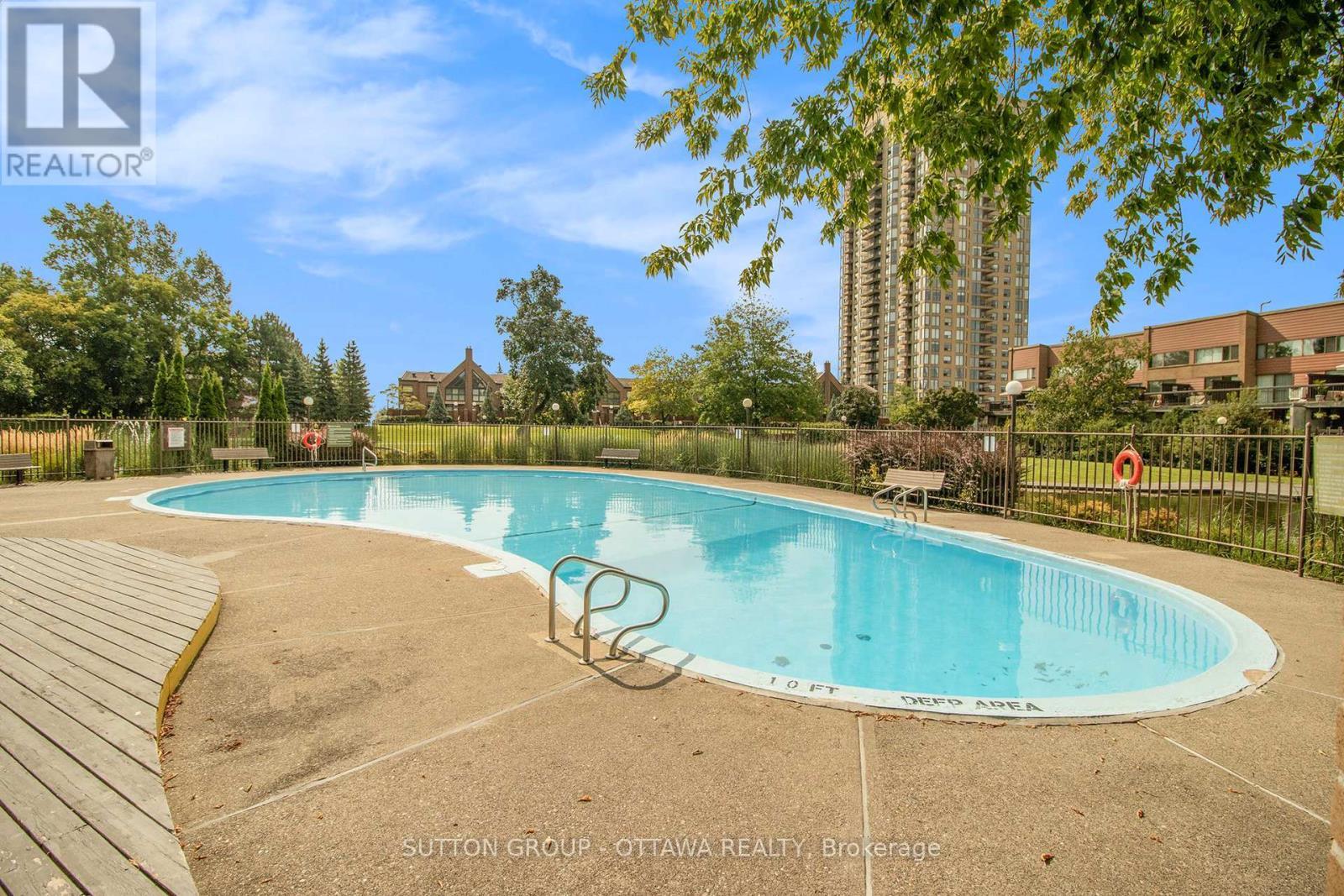 314 - 270 Brittany Drive, Ottawa, ON - Outdoor With In Ground Pool With Backyard