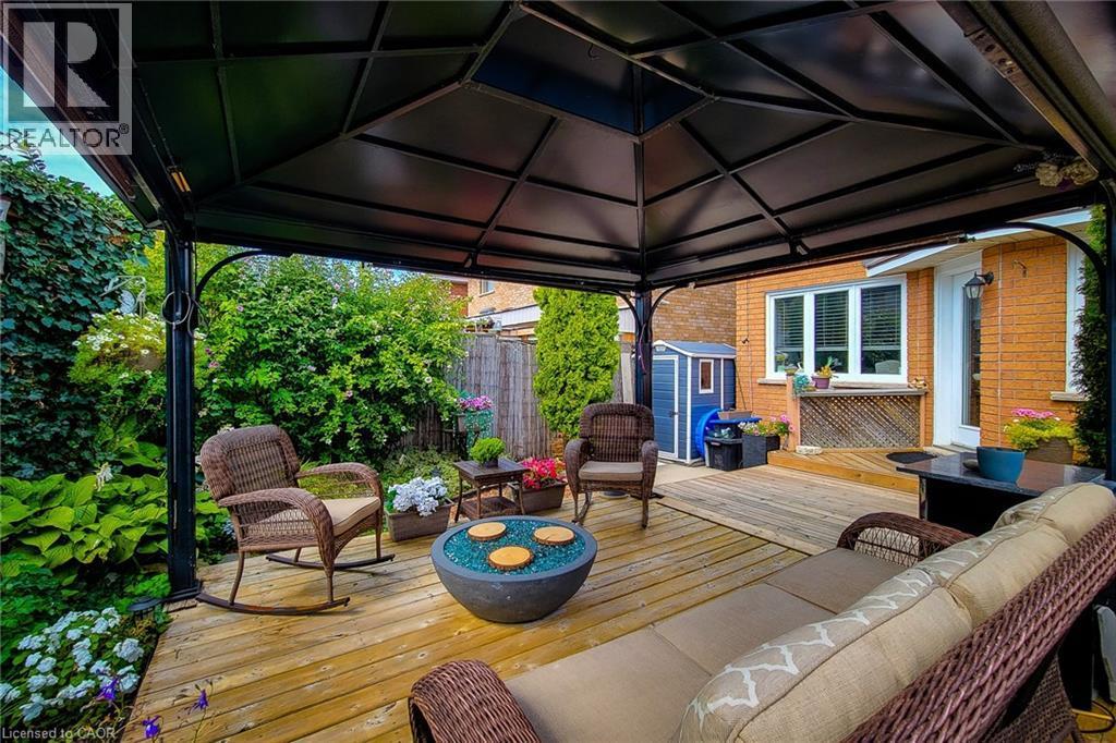 Expansive wooden deck featuring a metal-framed gazebo, surrounded by lush perimeter landscaping - 146 Locheed Drive, Hamilton, ON - Outdoor With Deck Patio Veranda