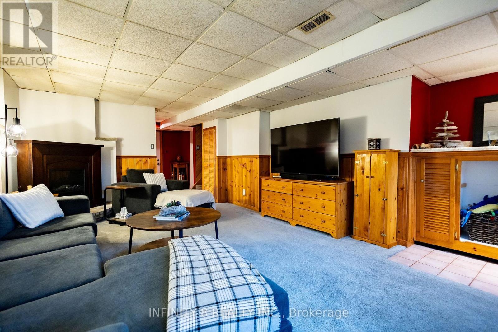 Large Family Room with Electric Fireplace - 38 Crescentwood Drive, St. Catharines (Lakeport), ON - Indoor Photo Showing Living Room With Fireplace