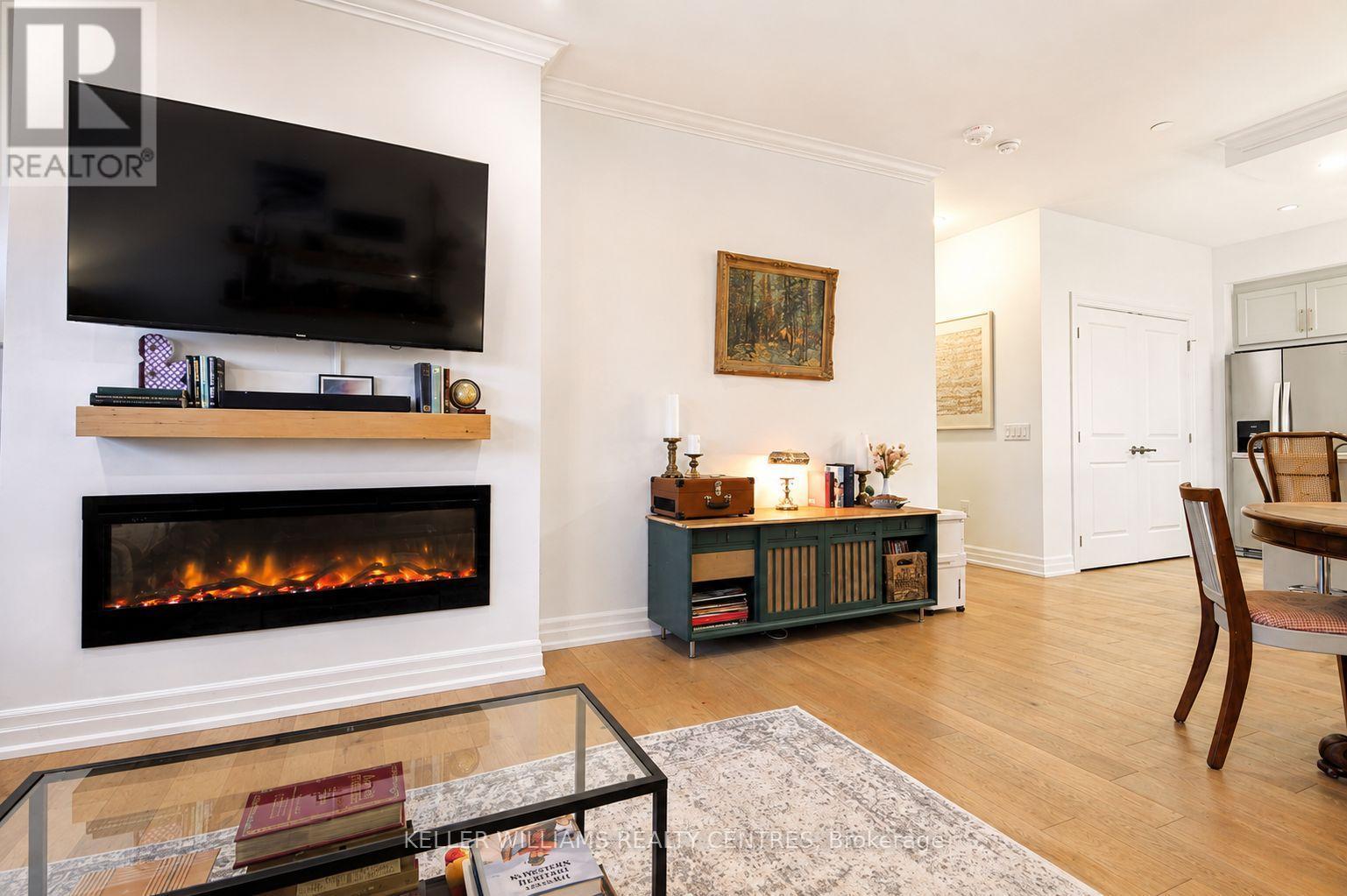 Beautiful fireplace ambiance in any season - 1107 - 1880 Gordon Street, Guelph, ON - Indoor Photo Showing Living Room With Fireplace