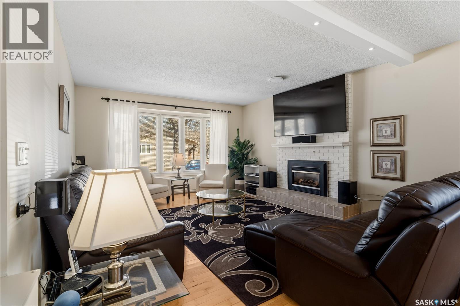6 Selkirk Crescent, Regina, SK - Indoor Photo Showing Living Room With Fireplace