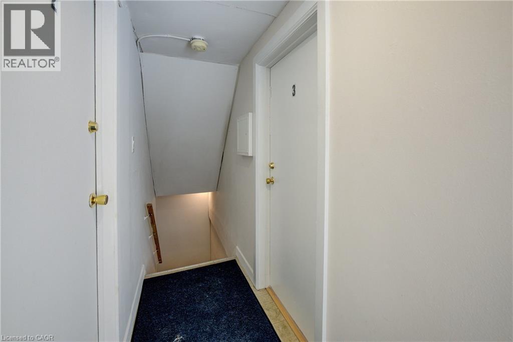 White interior doors with brass hardware - 3355 King Street E, Kitchener, ON - Indoor Photo Showing Other Room