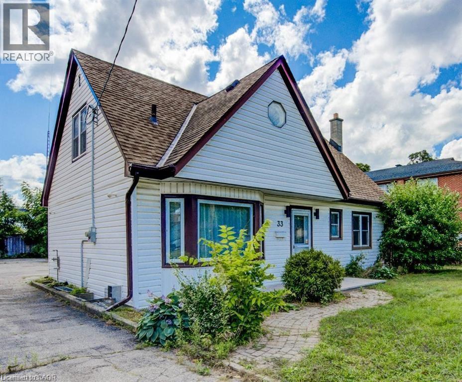 Gable-front home featuring white siding and a brown shingle roof - 33 Sixth Avenue, Kitchener, ON - Outdoor