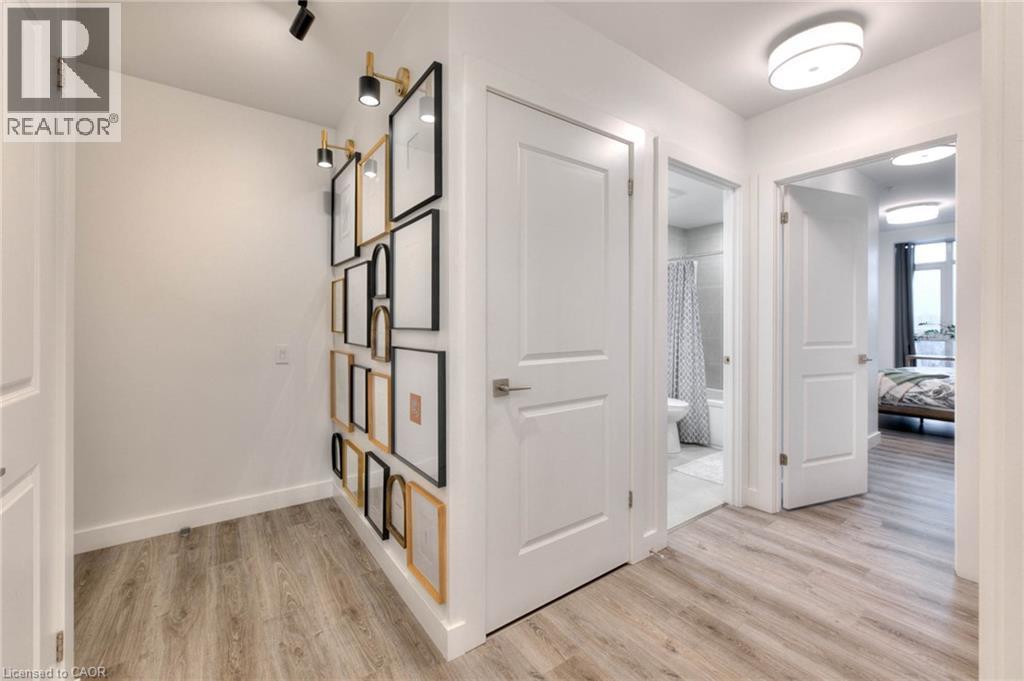 Hallway featuring light wood-style flooring and baseboards - 50 Grand Avenue S Unit# 602, Cambridge, ON - Indoor Photo Showing Other Room