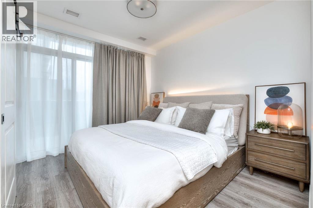 Bedroom featuring light wood-style floors - 50 Grand Avenue S Unit# 602, Cambridge, ON - Indoor Photo Showing Bedroom