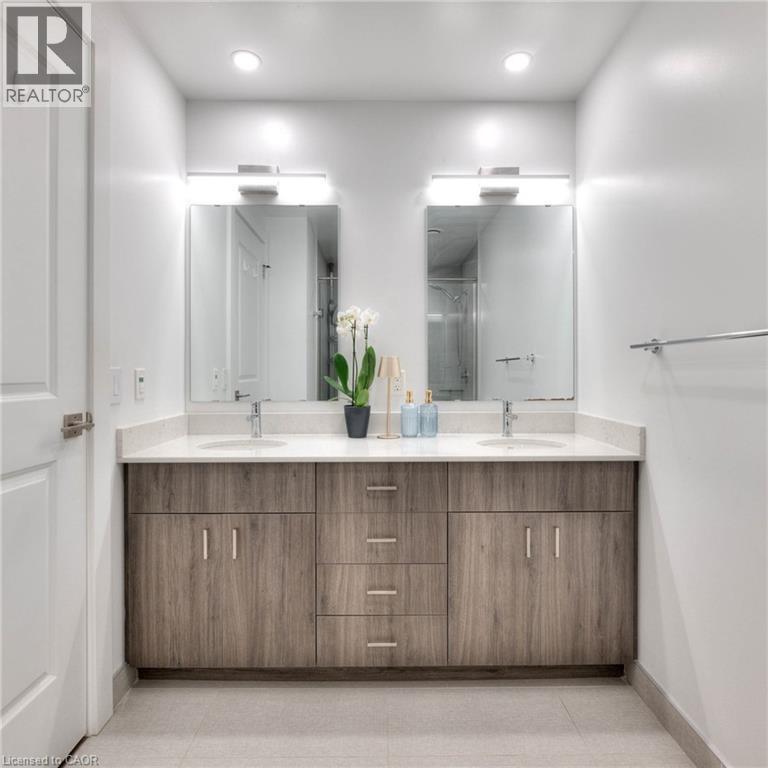 Bathroom featuring double vanity, recessed lighting, and a shower stall - 50 Grand Avenue S Unit# 602, Cambridge, ON - Indoor Photo Showing Bathroom