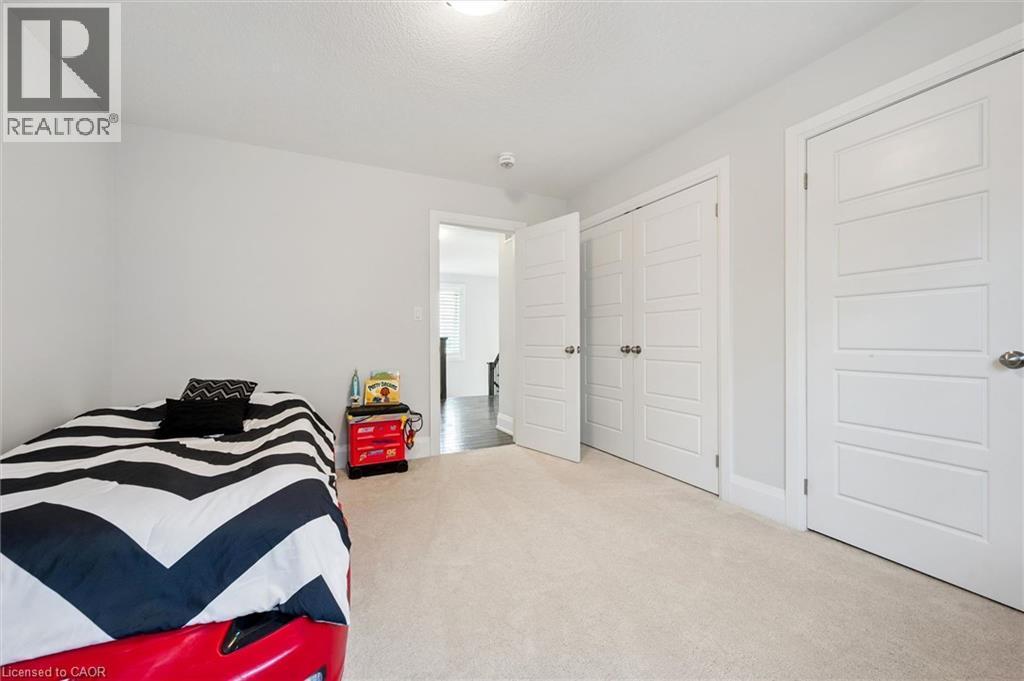 Soft neutral carpeting paired with light gray walls - 72 Elmbank Trail, Kitchener, ON - Indoor Photo Showing Bedroom