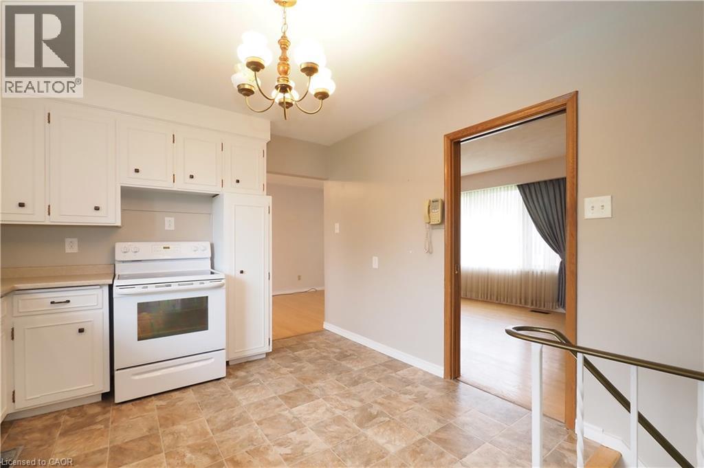 Kitchen with door to living room - 76 Cloverdale Crescent, Kitchener, ON - Indoor Photo Showing Kitchen