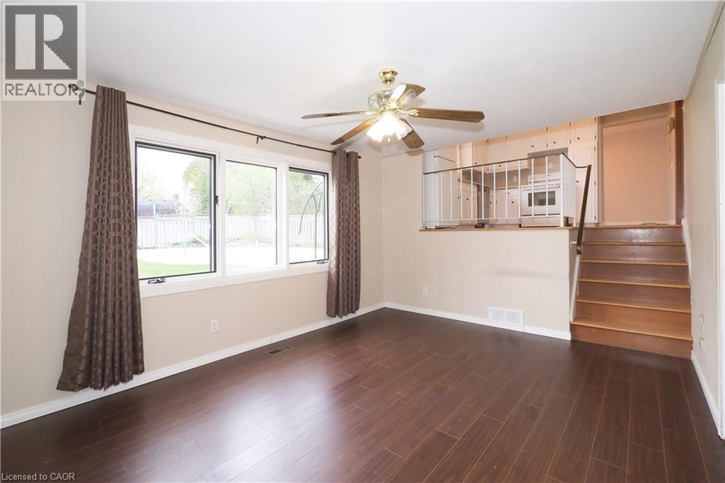 Family room with large window overlooking private back yard - 76 Cloverdale Crescent, Kitchener, ON - Indoor Photo Showing Other Room