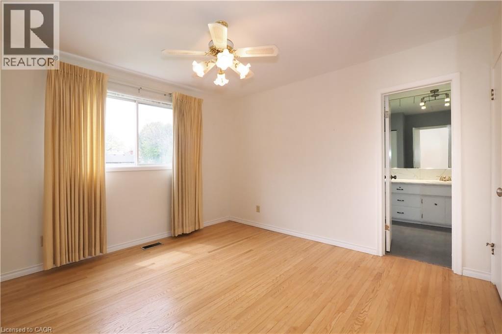 Primary bedroom with door to 5-piece bathroom - 76 Cloverdale Crescent, Kitchener, ON - Indoor Photo Showing Other Room