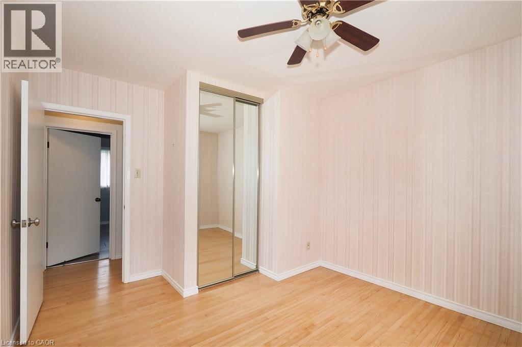 Bedroom featuring full height/width mirrored closet doors - 76 Cloverdale Crescent, Kitchener, ON - Indoor Photo Showing Other Room