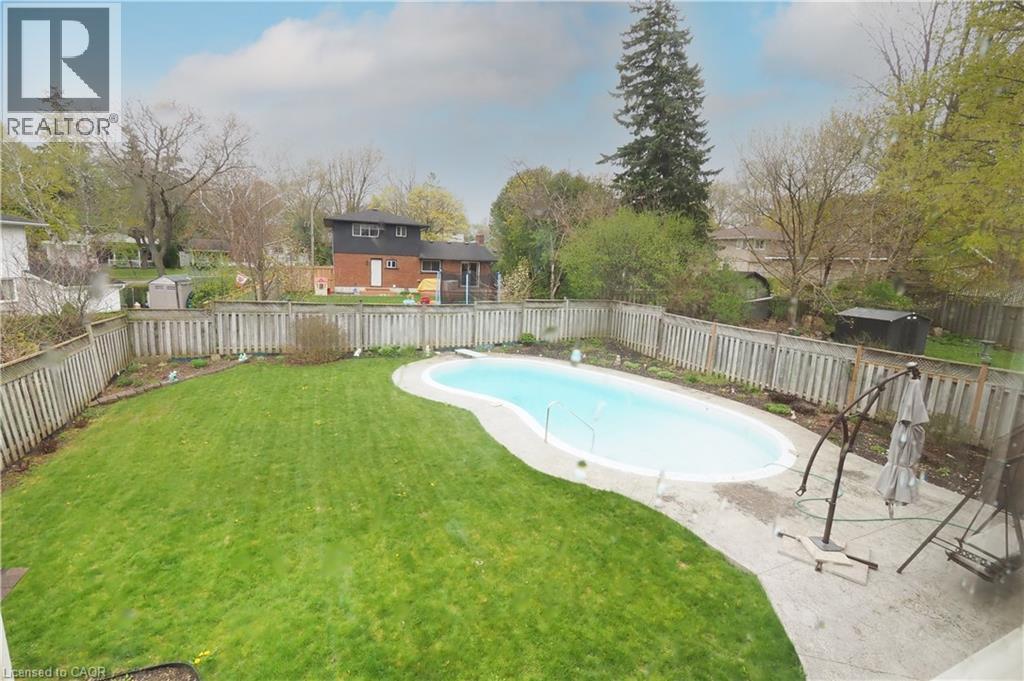 Fenced backyard with patio & gunite pool - 76 Cloverdale Crescent, Kitchener, ON - Outdoor With In Ground Pool With Backyard