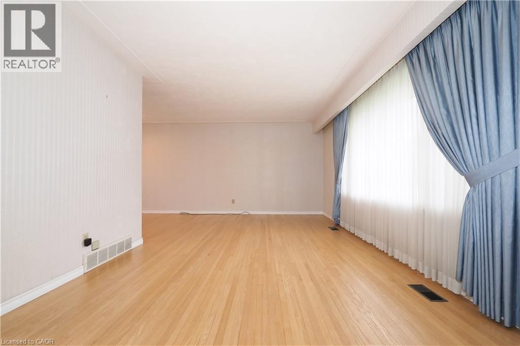 Living room with beautifully refinished hardwood flooring - 76 Cloverdale Crescent, Kitchener, ON - Indoor Photo Showing Other Room
