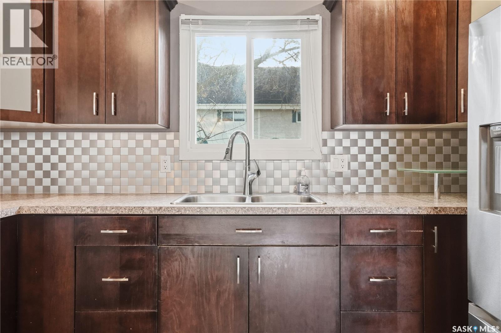 15 Killarney Way, Regina, SK - Indoor Photo Showing Kitchen With Double Sink