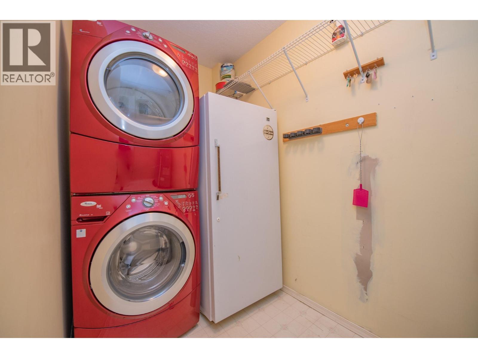 Laundry room off entry, stand up freezer included - 3929 22 Avenue Unit# 309, Vernon, BC - Indoor Photo Showing Laundry Room