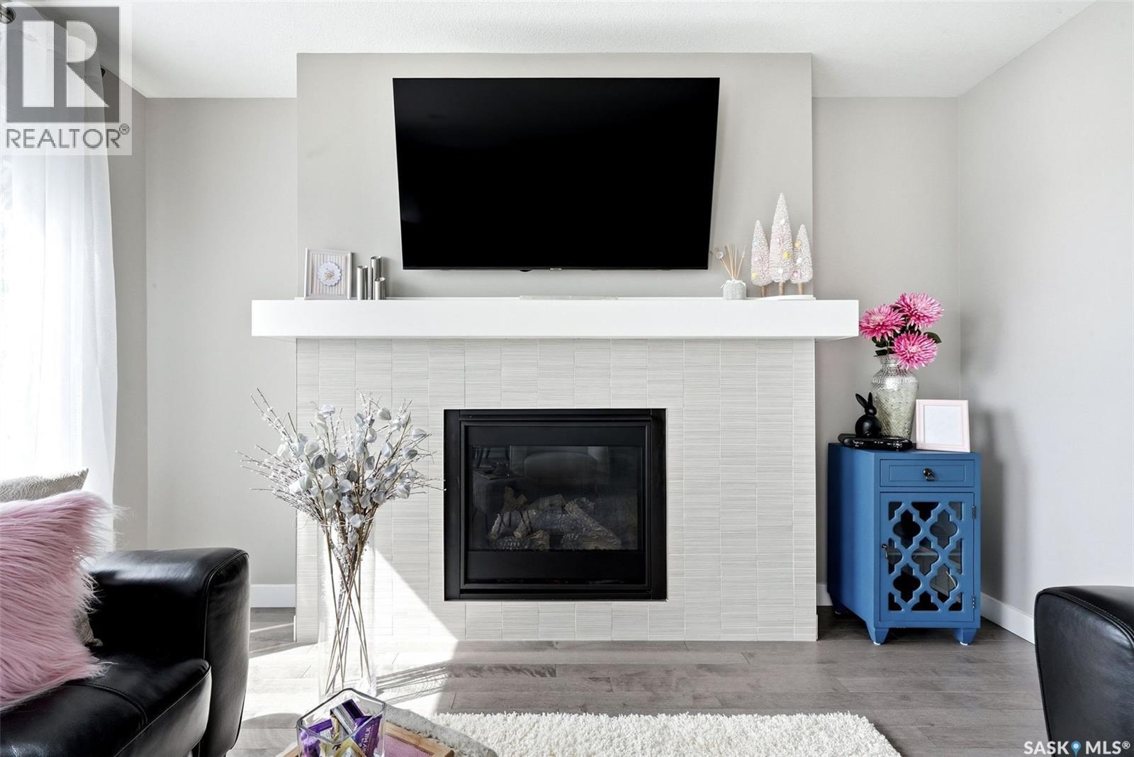 8849 Kestral Drive, Regina, SK - Indoor Photo Showing Living Room With Fireplace