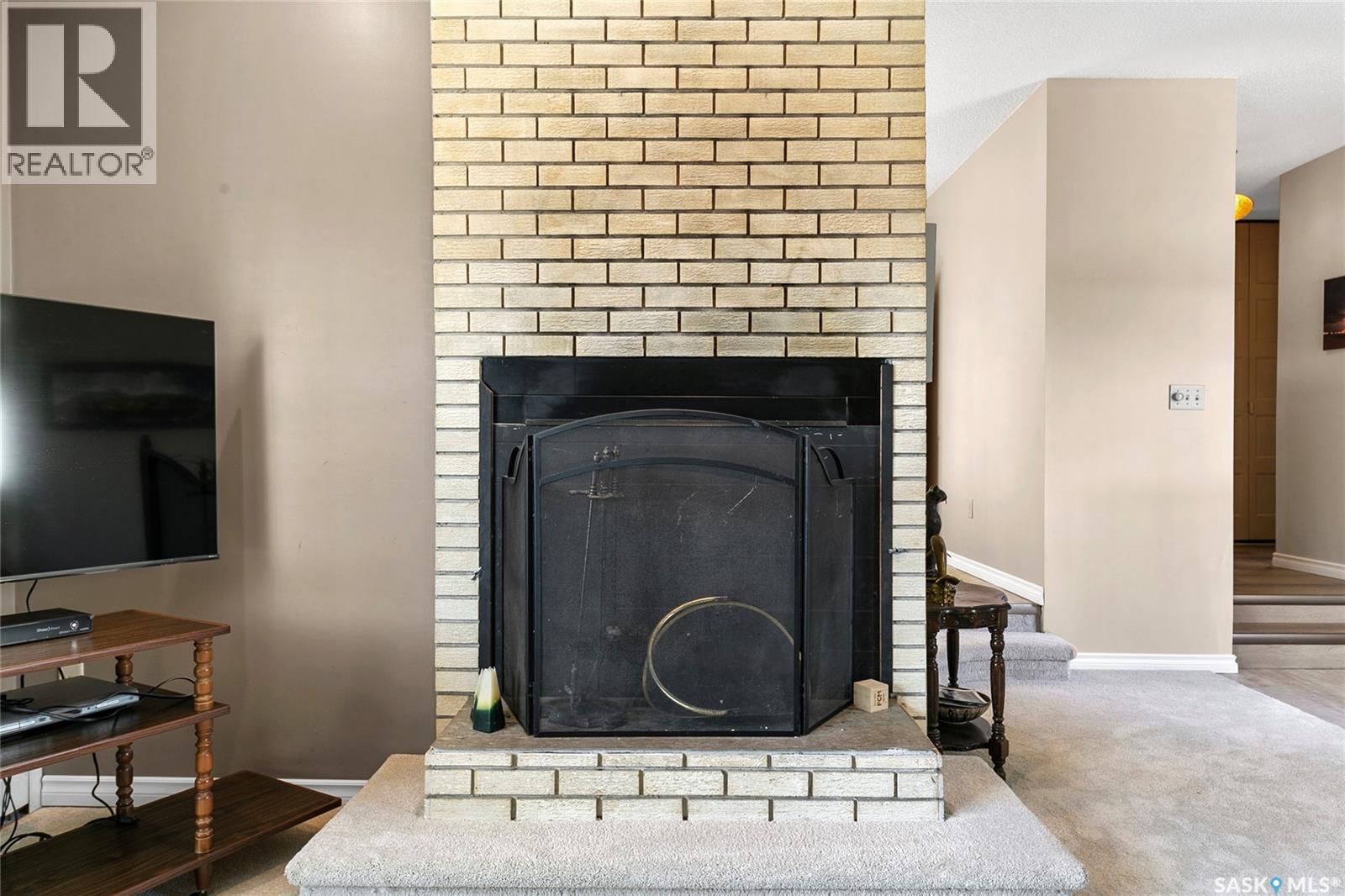 116 Stuart Street, Cupar, SK - Indoor Photo Showing Living Room With Fireplace