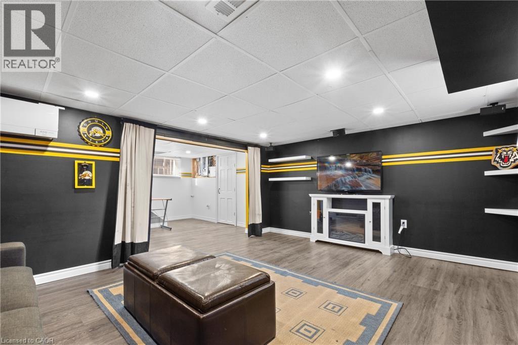 Finished living space featuring wood-finish flooring and recessed ceiling lighting - 204 Beach Boulevard, Hamilton, ON - Indoor