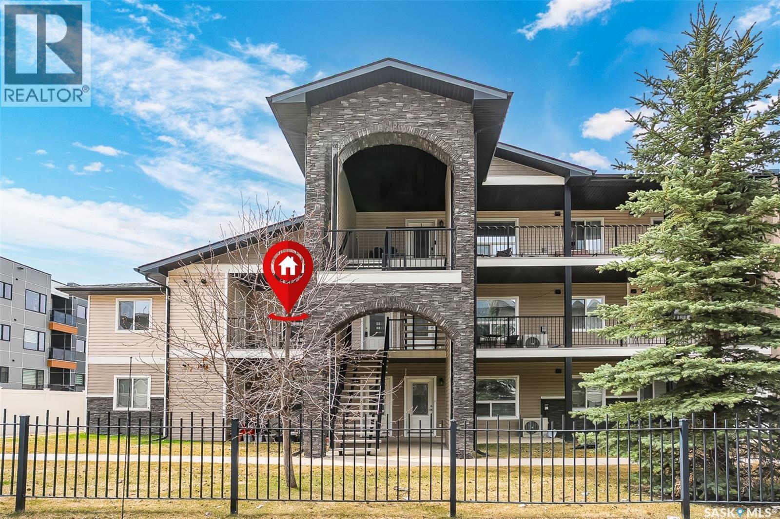 128 125 Willis Crescent, Saskatoon, SK - Outdoor With Balcony With Facade