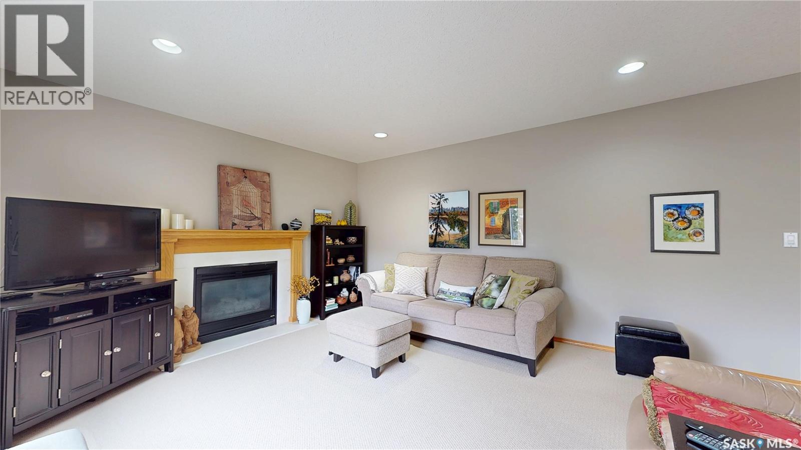 11172 Wascana Meadows, Regina, SK - Indoor Photo Showing Living Room With Fireplace