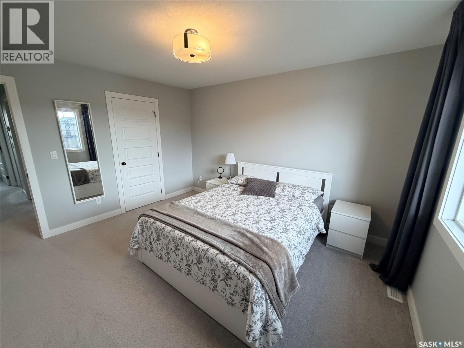 22 1003 Evergreen Boulevard, Saskatoon, SK - Indoor Photo Showing Bedroom