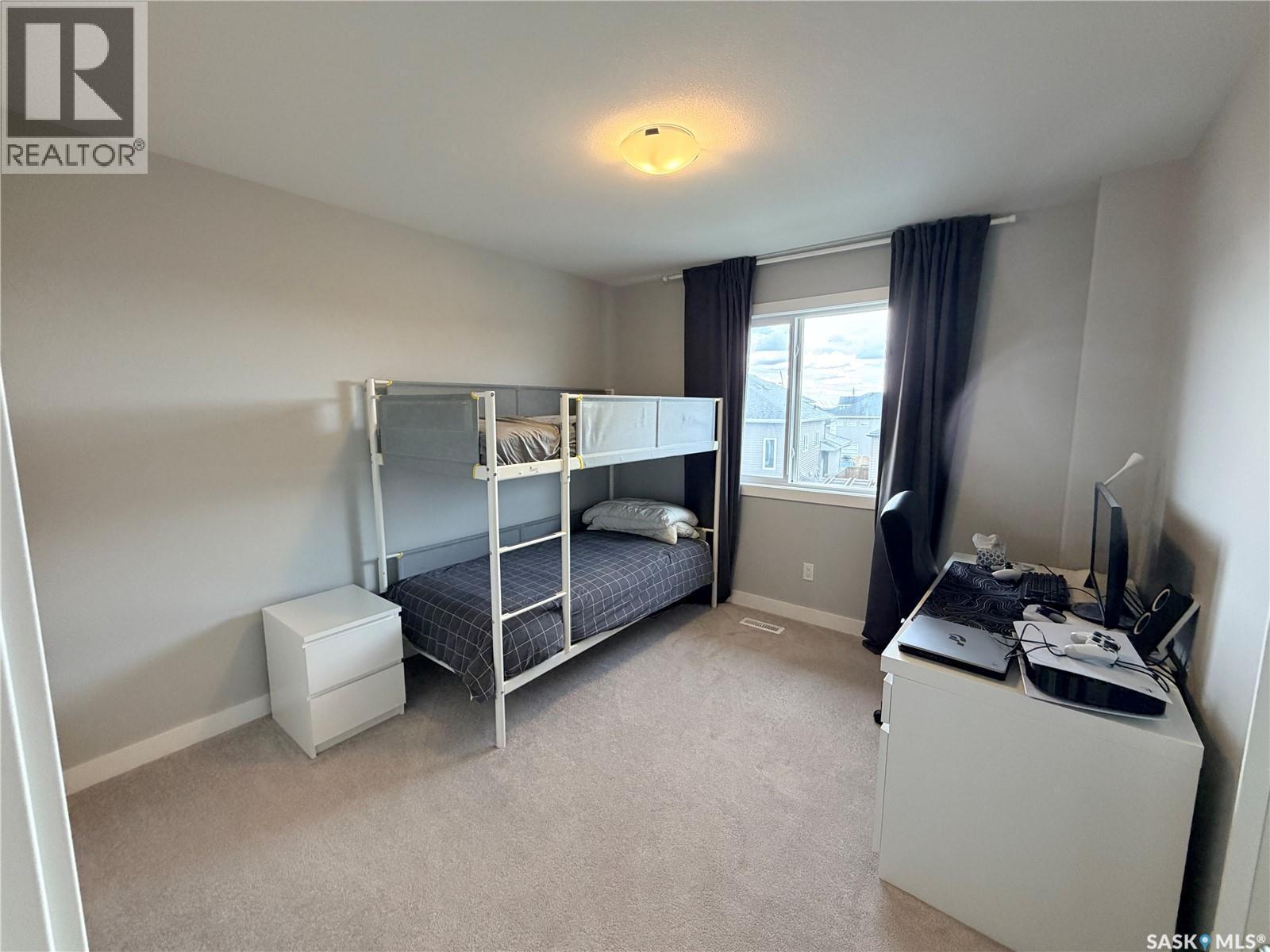 22 1003 Evergreen Boulevard, Saskatoon, SK - Indoor Photo Showing Bedroom