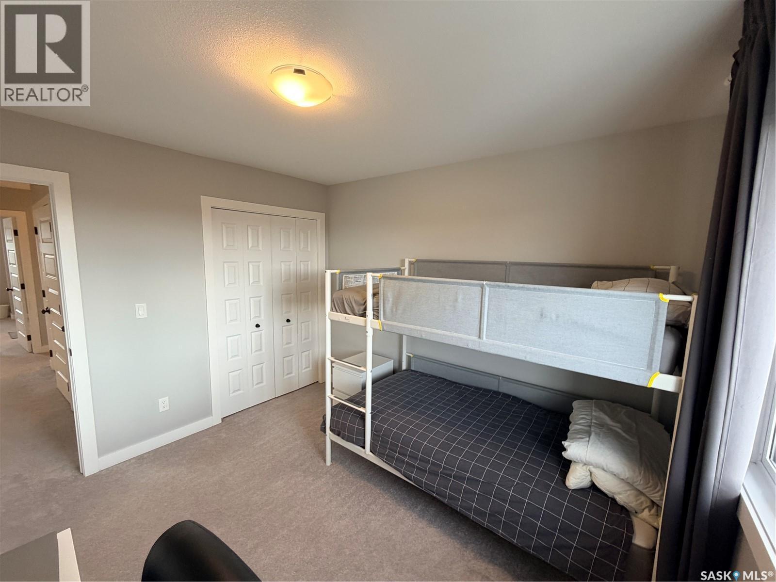 22 1003 Evergreen Boulevard, Saskatoon, SK - Indoor Photo Showing Bedroom