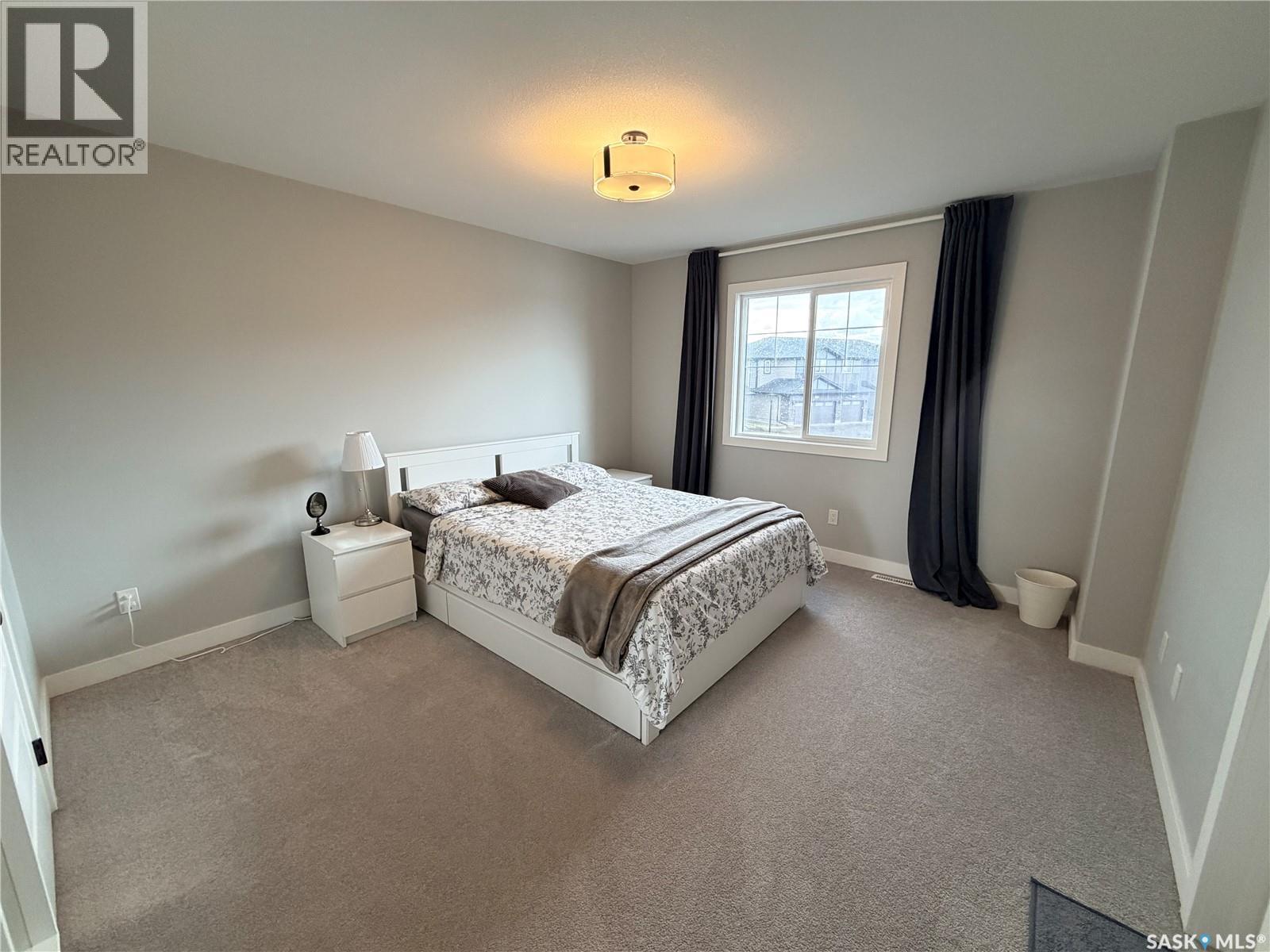 22 1003 Evergreen Boulevard, Saskatoon, SK - Indoor Photo Showing Bedroom