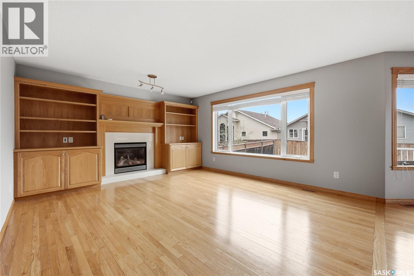 9382 Wascana Mews, Regina, SK - Indoor Photo Showing Living Room With Fireplace