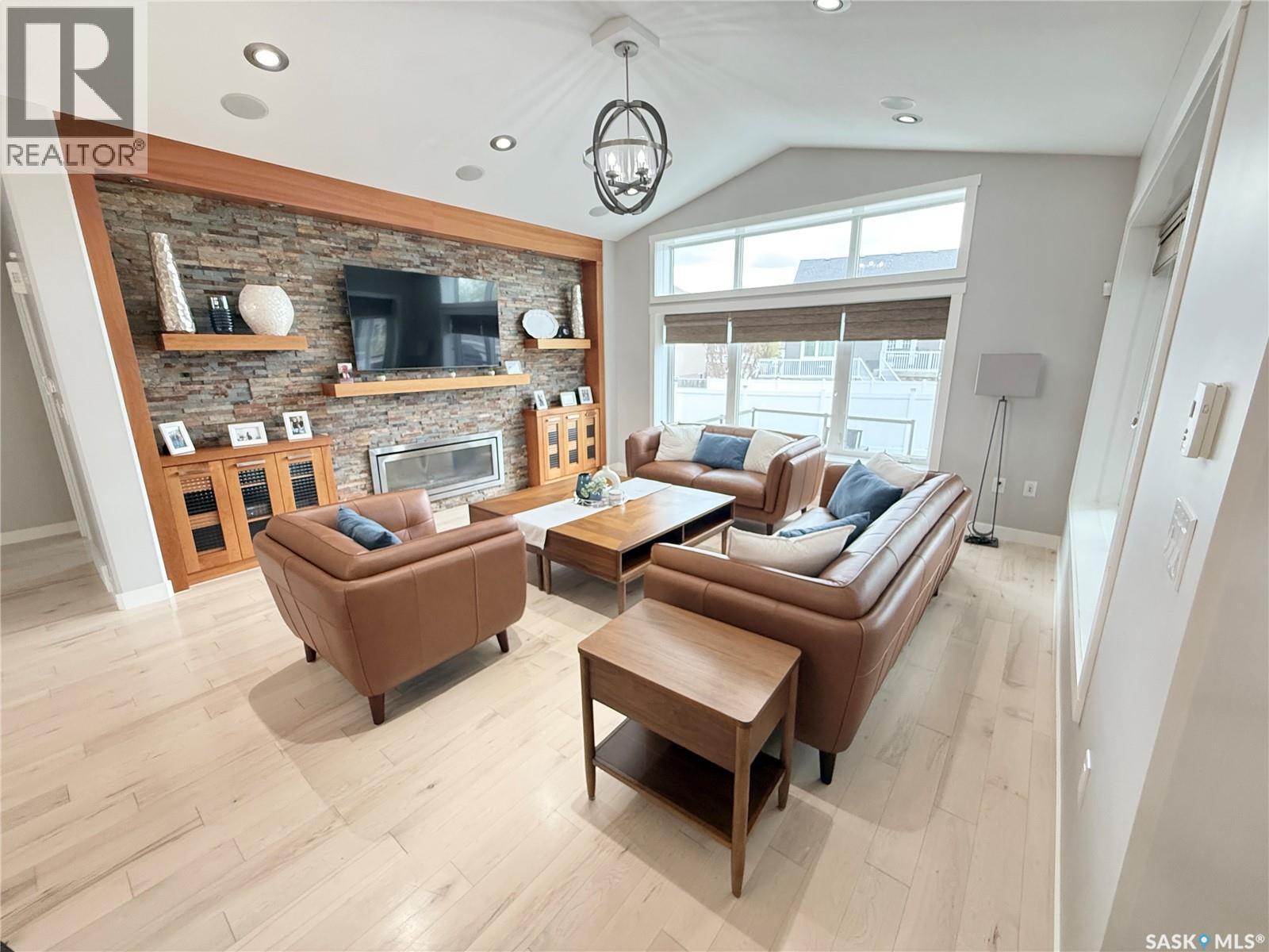 1832 Gordon Miles Place, Weyburn, SK - Indoor Photo Showing Living Room With Fireplace