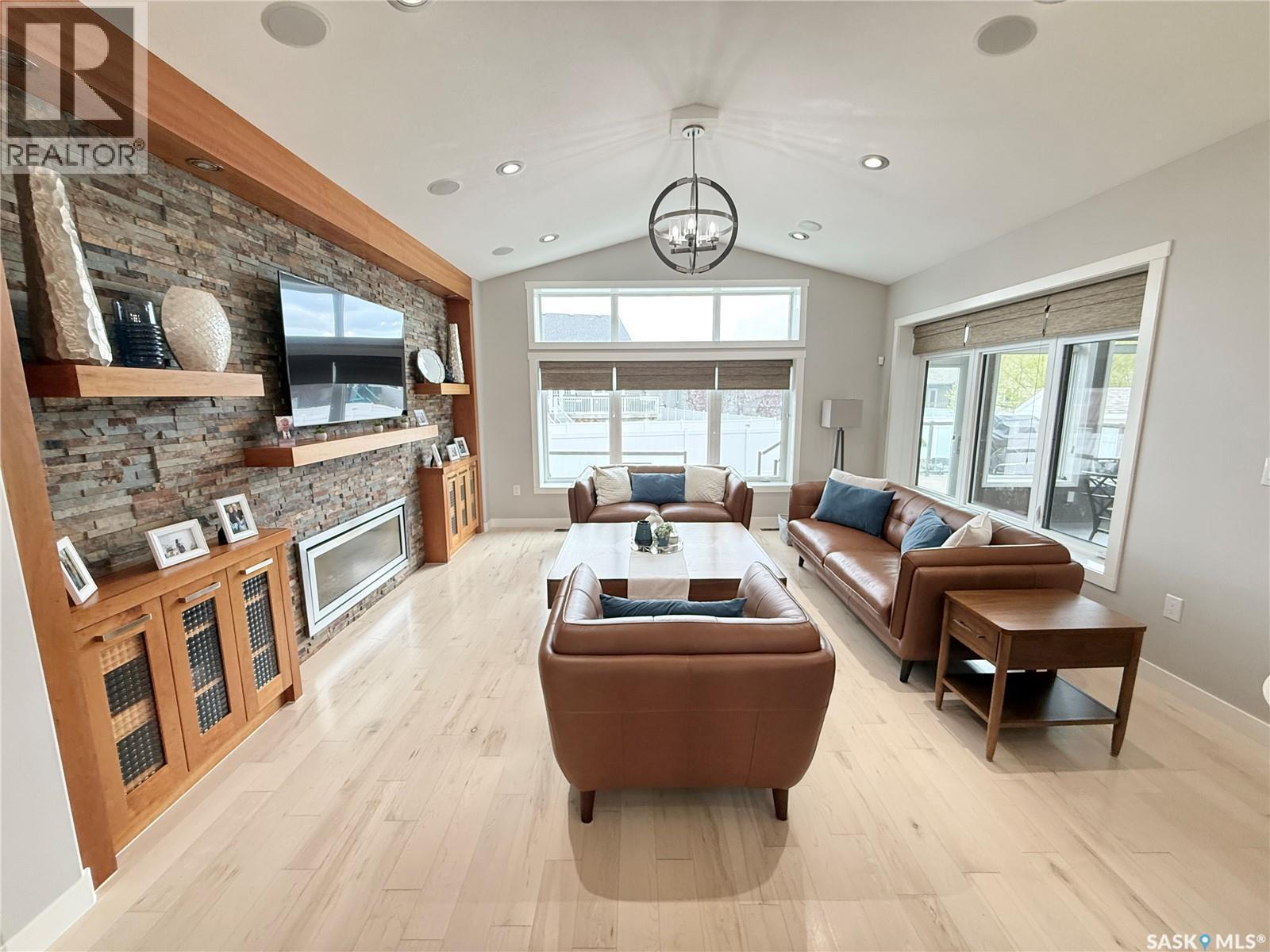 1832 Gordon Miles Place, Weyburn, SK - Indoor Photo Showing Living Room With Fireplace
