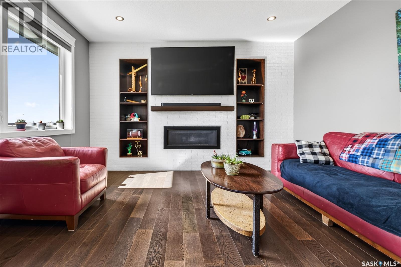 156 Iron Bridge Drive, Moose Jaw, SK - Indoor Photo Showing Living Room With Fireplace