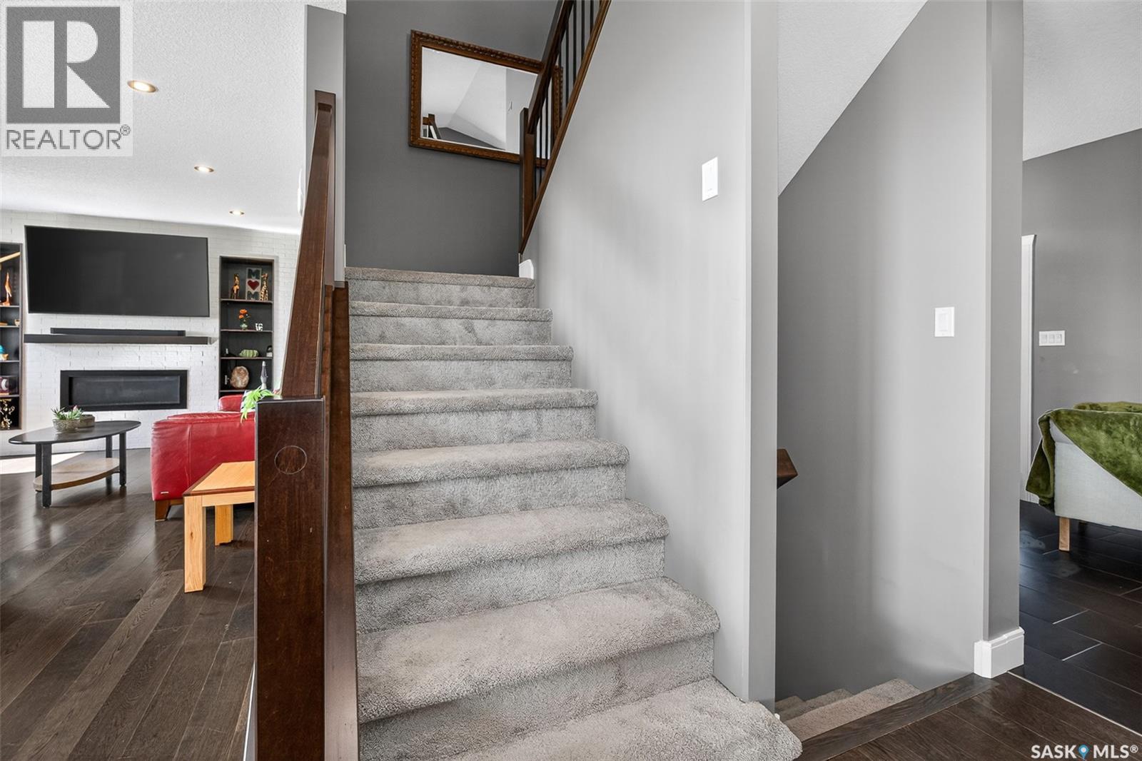 156 Iron Bridge Drive, Moose Jaw, SK - Indoor Photo Showing Other Room With Fireplace