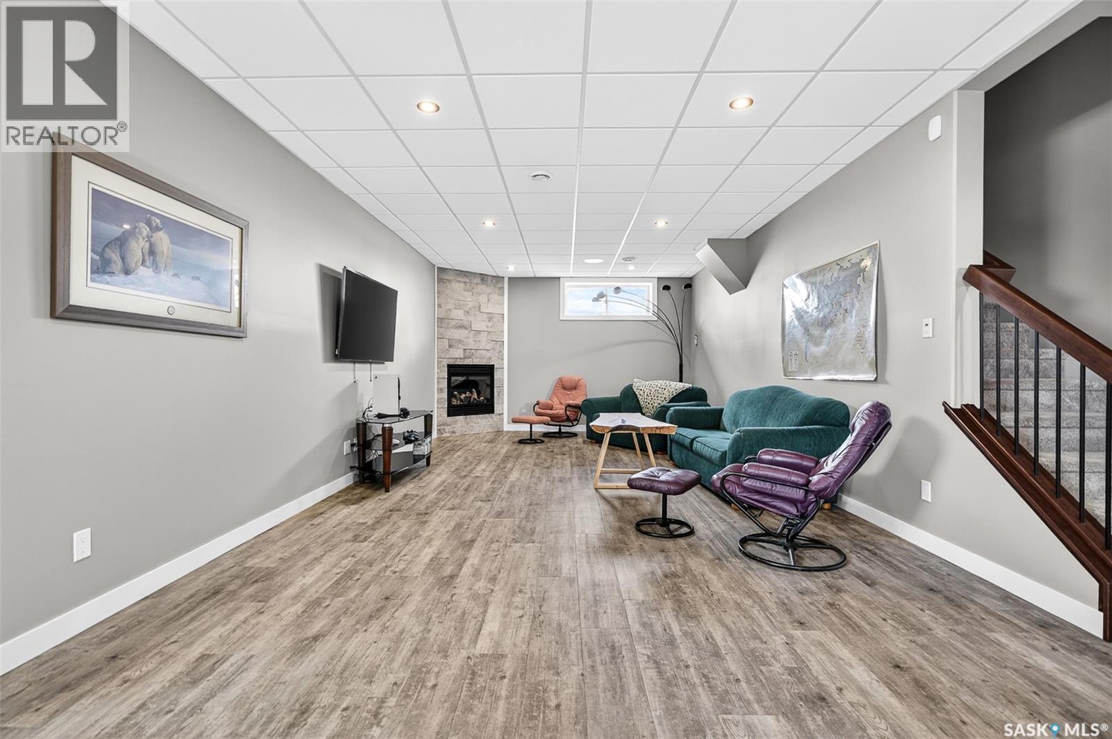 156 Iron Bridge Drive, Moose Jaw, SK - Indoor Photo Showing Other Room With Fireplace