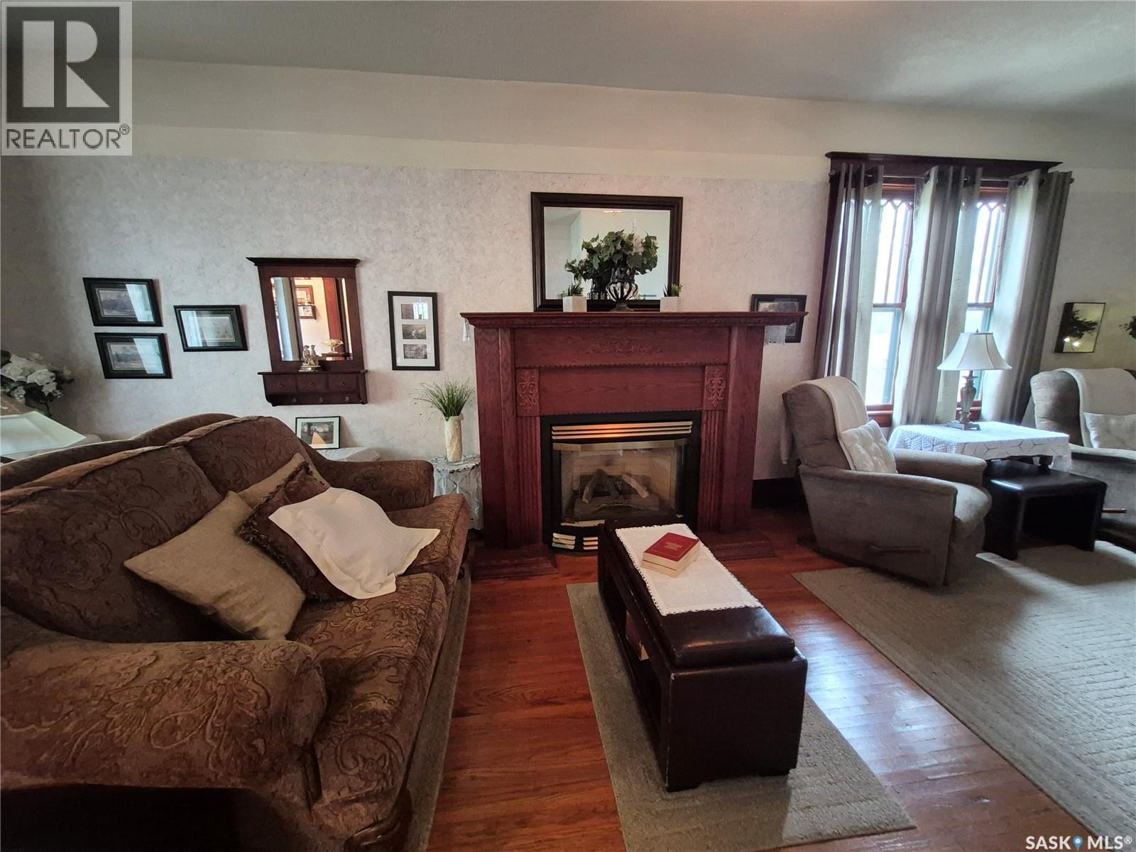 244 3Rd Avenue Nw, Swift Current, SK - Indoor Photo Showing Living Room With Fireplace