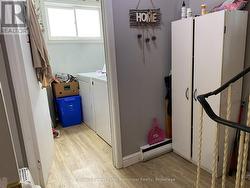 Laundry room just off kitchen, third level. -