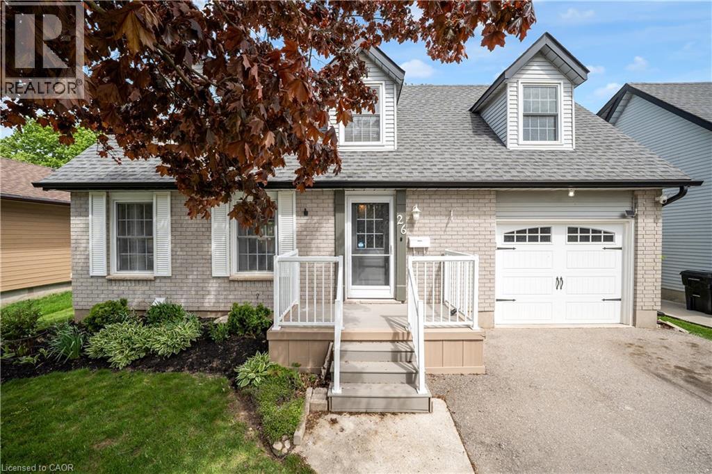 Light gray brick exterior with white trim and a gabled roofline - 26 Peachtree Crescent, Cambridge, ON - Outdoor With Facade