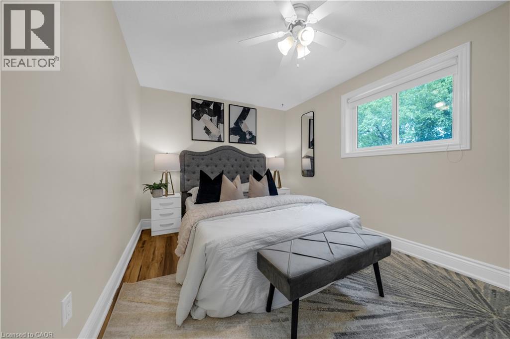 Bedroom featuring wood-finish flooring, neutral wall tones, and crown molding - 26 Peachtree Crescent, Cambridge, ON - Indoor Photo Showing Bedroom