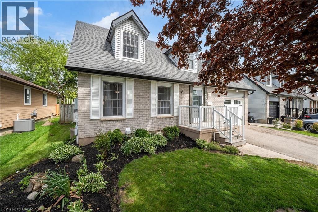 Brick exterior with a dormer window and white shutters - 26 Peachtree Crescent, Cambridge, ON - Outdoor