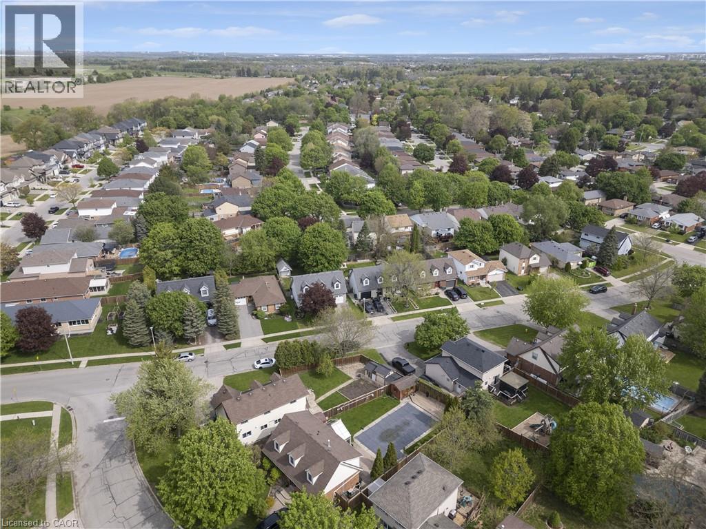Aerial perspective showcasing a residential neighborhood with mature trees and a range of single-family homes - 26 Peachtree Crescent, Cambridge, ON - Outdoor With View