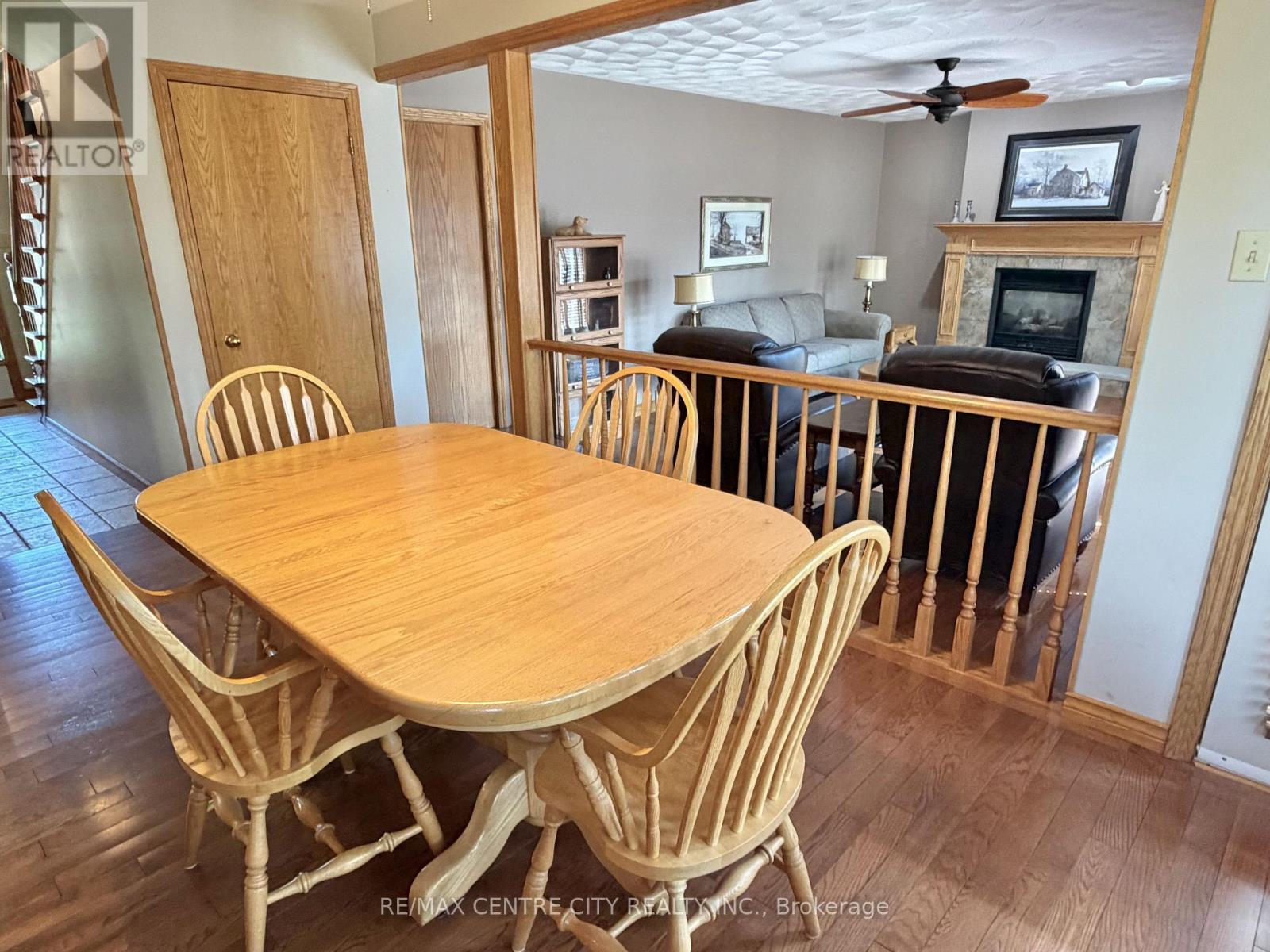 EATING AREA OVERLOOKING FAMILY ROOM - 31 Cavanaugh Crescent, St. Thomas, ON - Indoor Photo Showing Dining Room With Fireplace