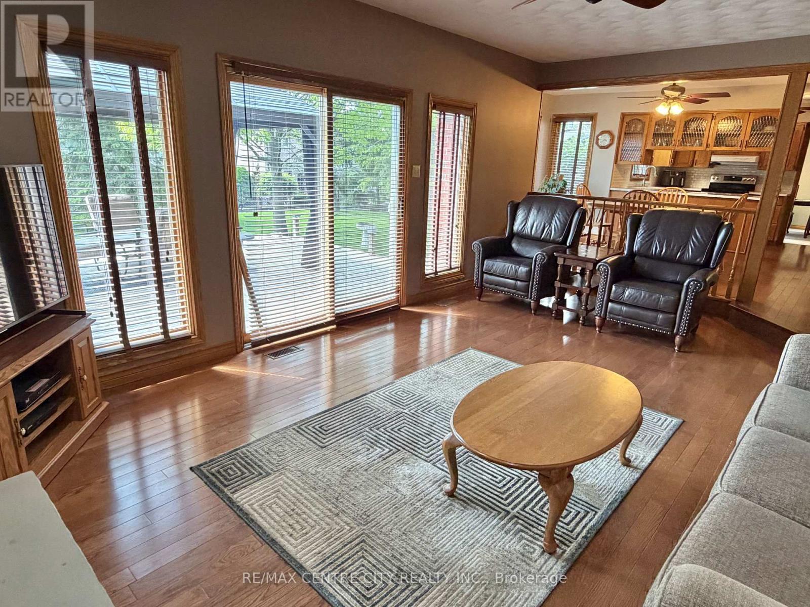 FAMILY ROOM WITH SLIDING DOORS TO REAR DECK - 31 Cavanaugh Crescent, St. Thomas, ON - Indoor Photo Showing Living Room With Fireplace