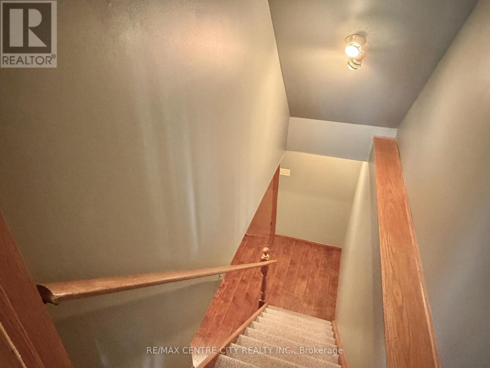 STAIRCASE TO BASEMENT LEVEL - 31 Cavanaugh Crescent, St. Thomas, ON - Indoor Photo Showing Other Room