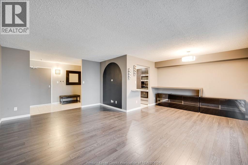 9099 Riverside Drive Unit# 221 E, Windsor, ON - Indoor Photo Showing Living Room With Fireplace