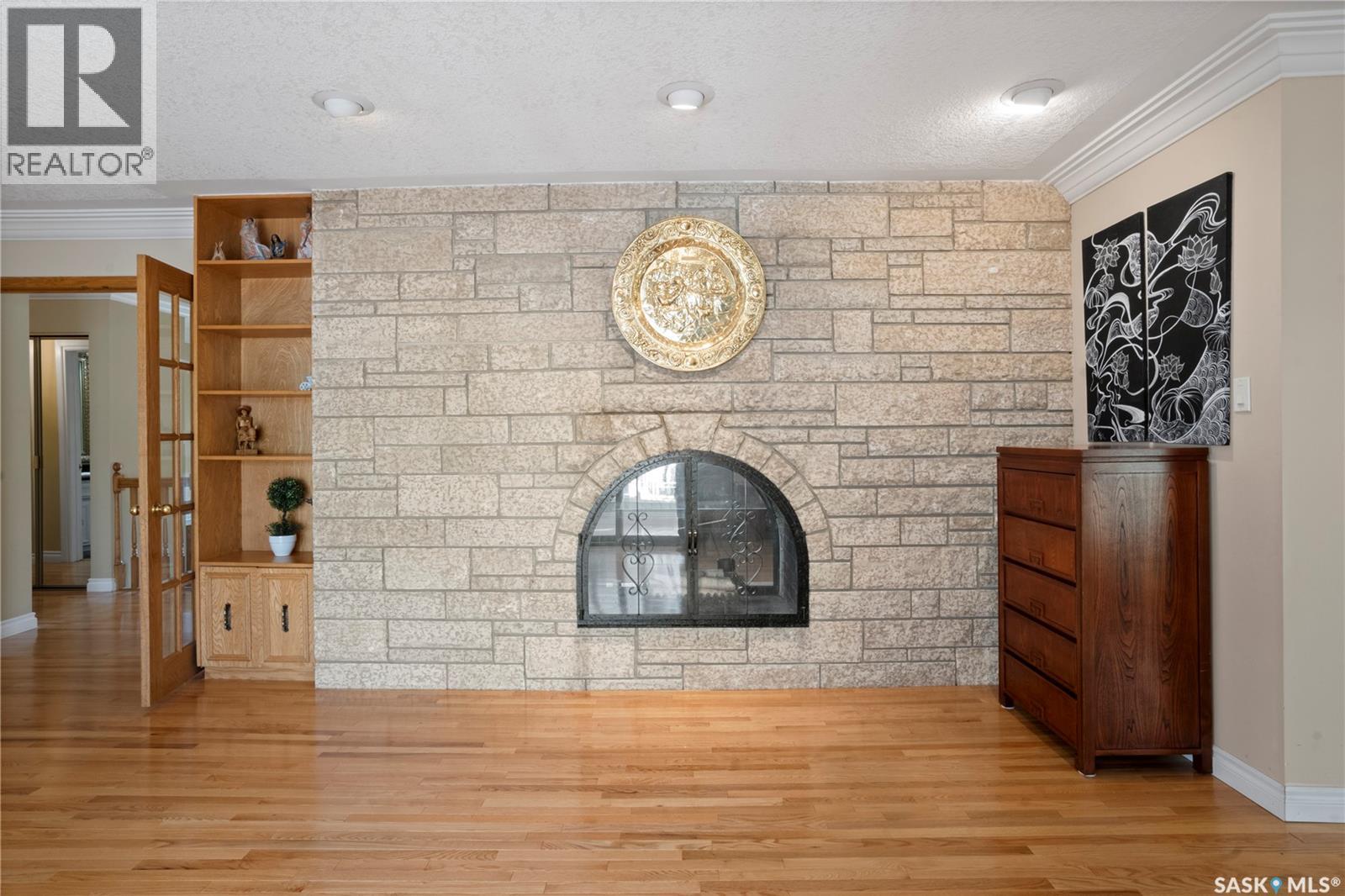 66 Leslie Place, Regina, SK - Indoor Photo Showing Other Room With Fireplace