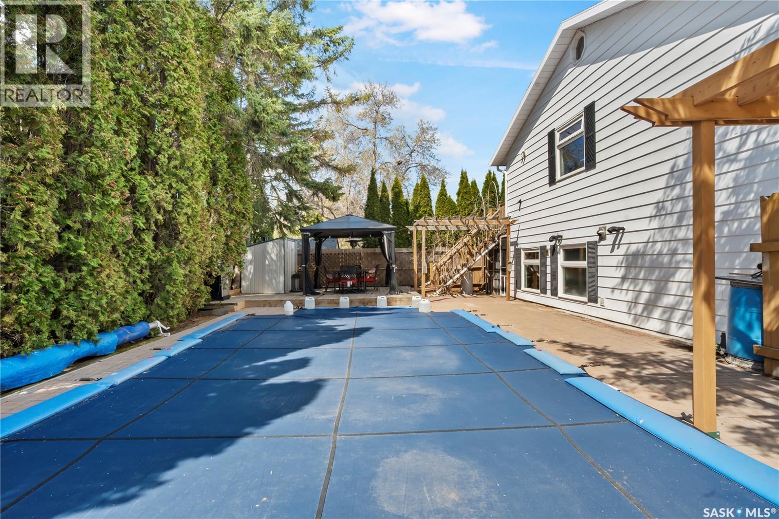 66 Leslie Place, Regina, SK - Outdoor With In Ground Pool