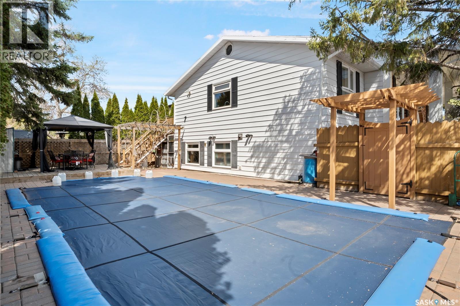 66 Leslie Place, Regina, SK - Outdoor With In Ground Pool